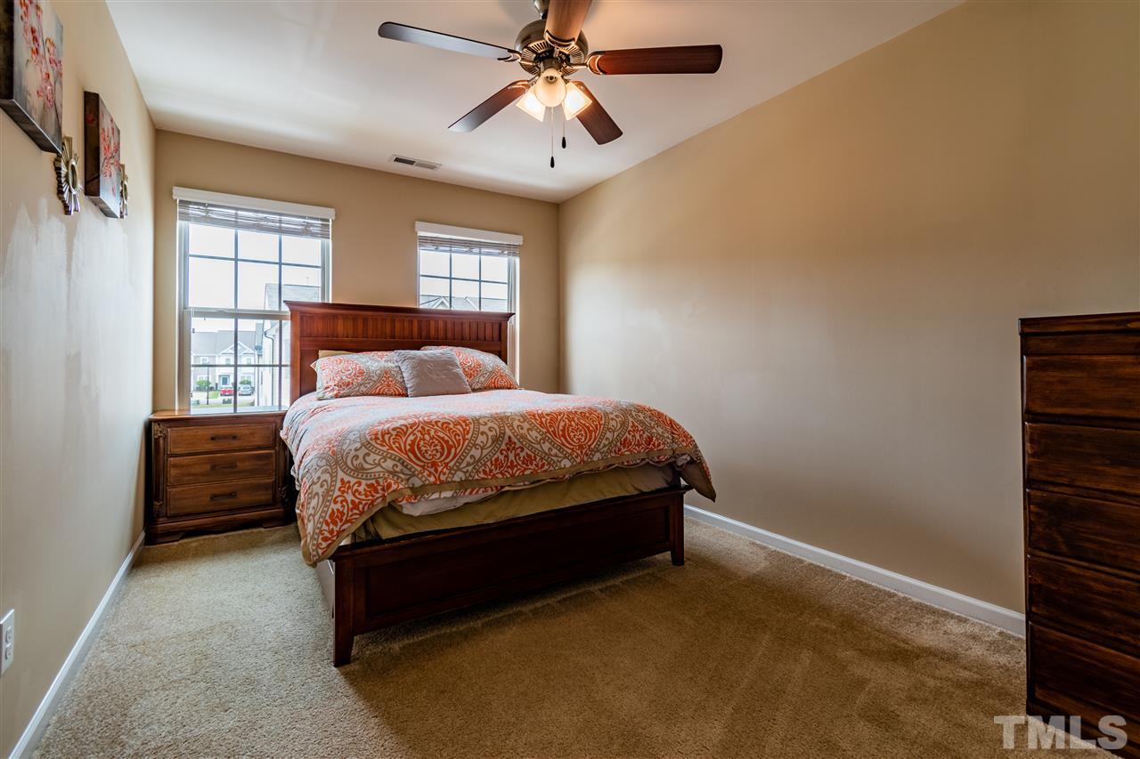 302 Leighann Ridge Lane Rolesville, NC 27571 - Photo 13 of 21 a bedroom with a bed and window