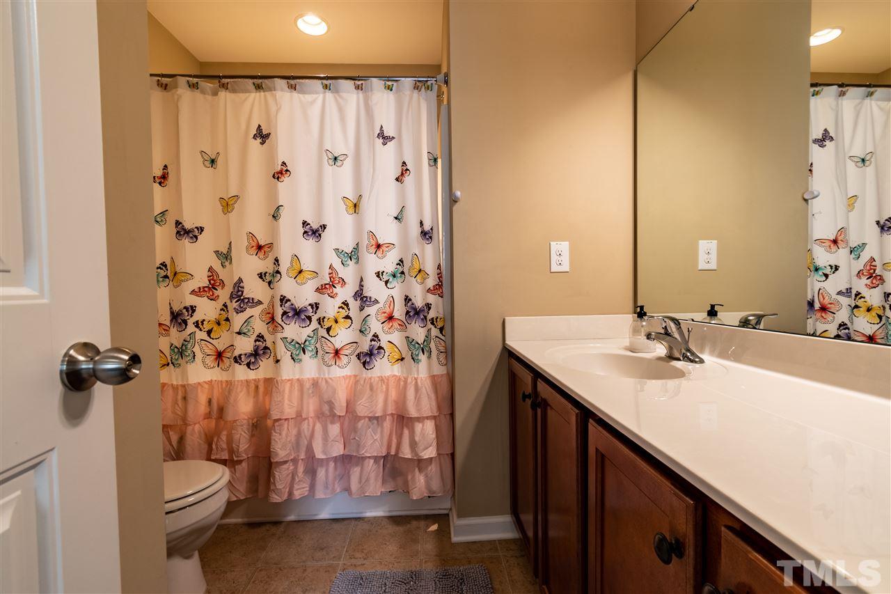302 Leighann Ridge Lane Rolesville, NC 27571 - Photo 15 of 21 a bathroom with a sink and a mirror