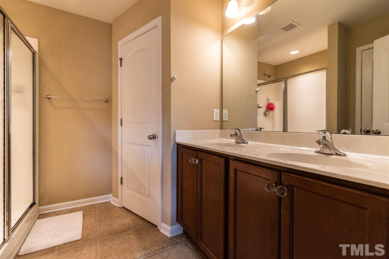302 Leighann Ridge Lane Rolesville, NC 27571 - Photo 19 of 21 a bathroom with a double vanity sink and a mirror