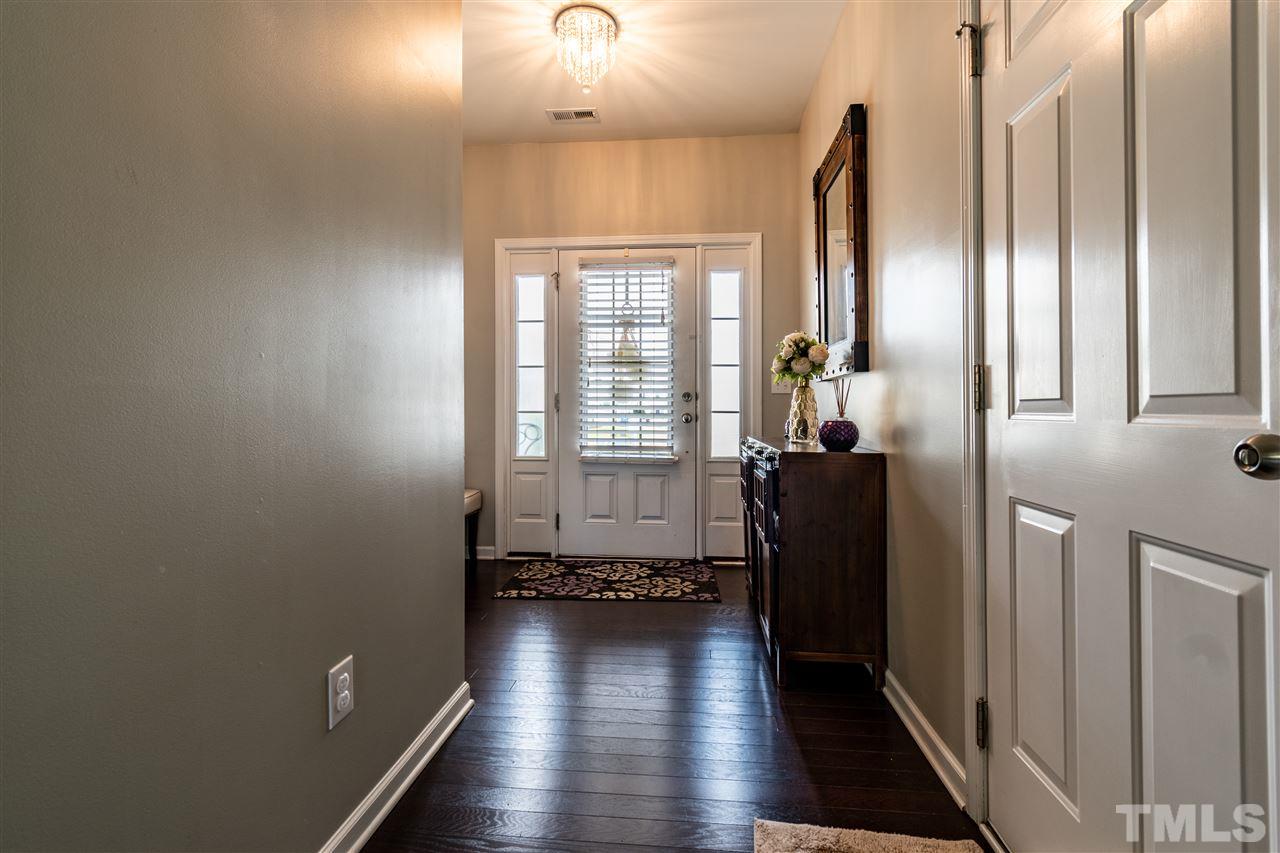 302 Leighann Ridge Lane Rolesville, NC 27571 - Photo 3 of 21 a view of a hallway with wooden floor and windows
