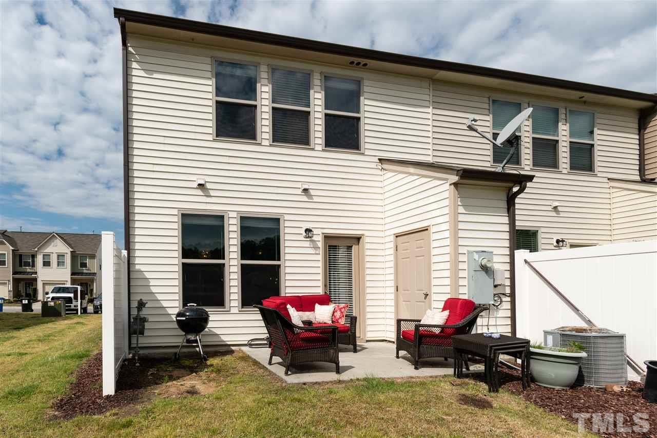302 Leighann Ridge Lane Rolesville, NC 27571 - Photo 21 of 21 a view of a house with a patio and a yard
