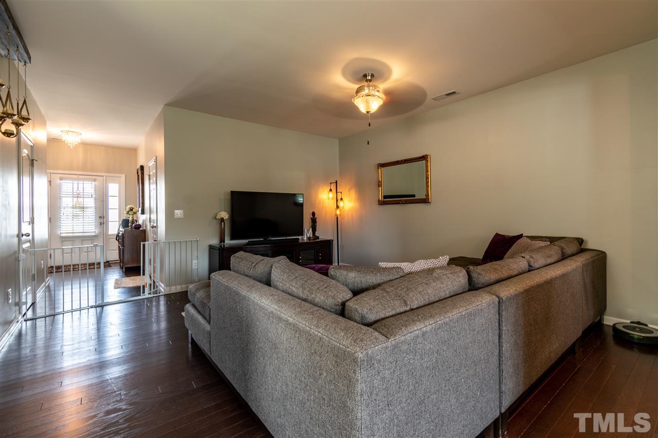 302 Leighann Ridge Lane Rolesville, NC 27571 - Photo 5 of 21 a living room with furniture and a flat screen tv