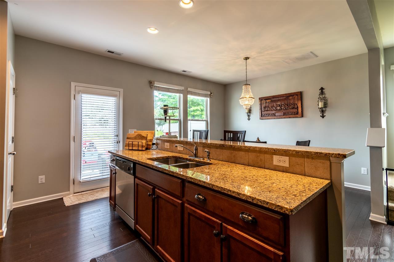 302 Leighann Ridge Lane Rolesville, NC 27571 - Photo 7 of 21 a kitchen with a stove and a sink