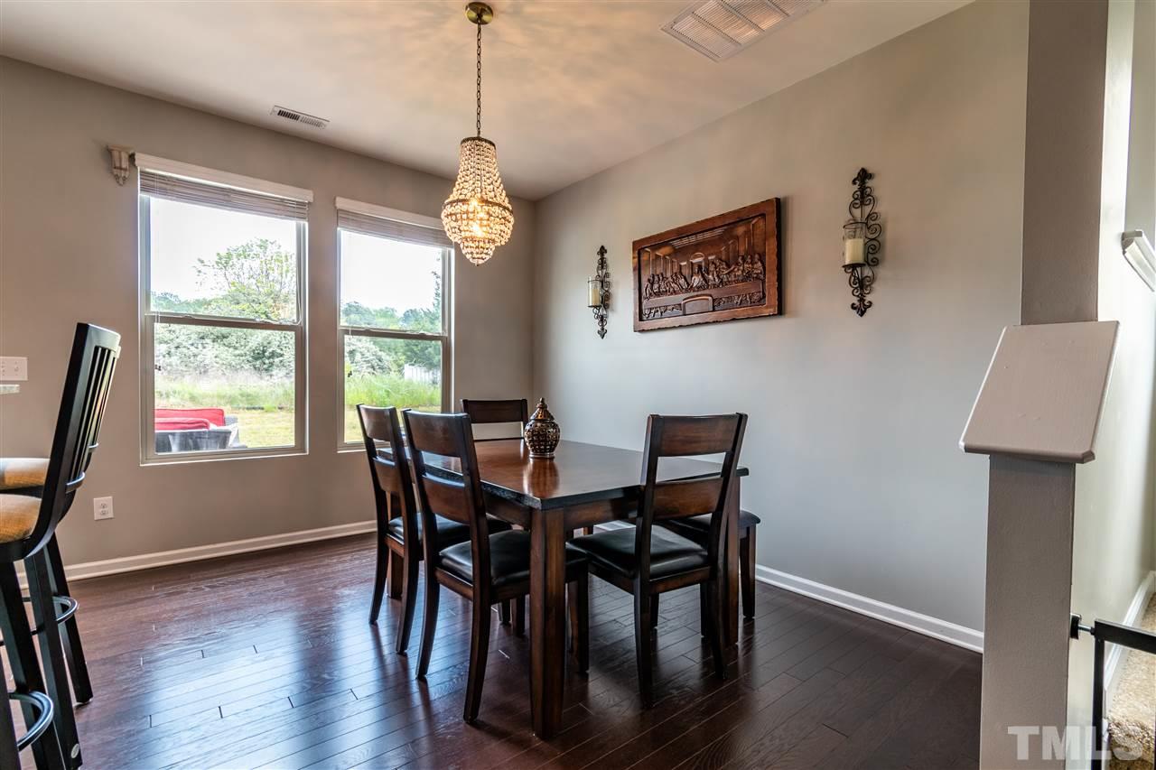 302 Leighann Ridge Lane Rolesville, NC 27571 - Photo 9 of 21 a view of a dining room with furniture window and wooden floor