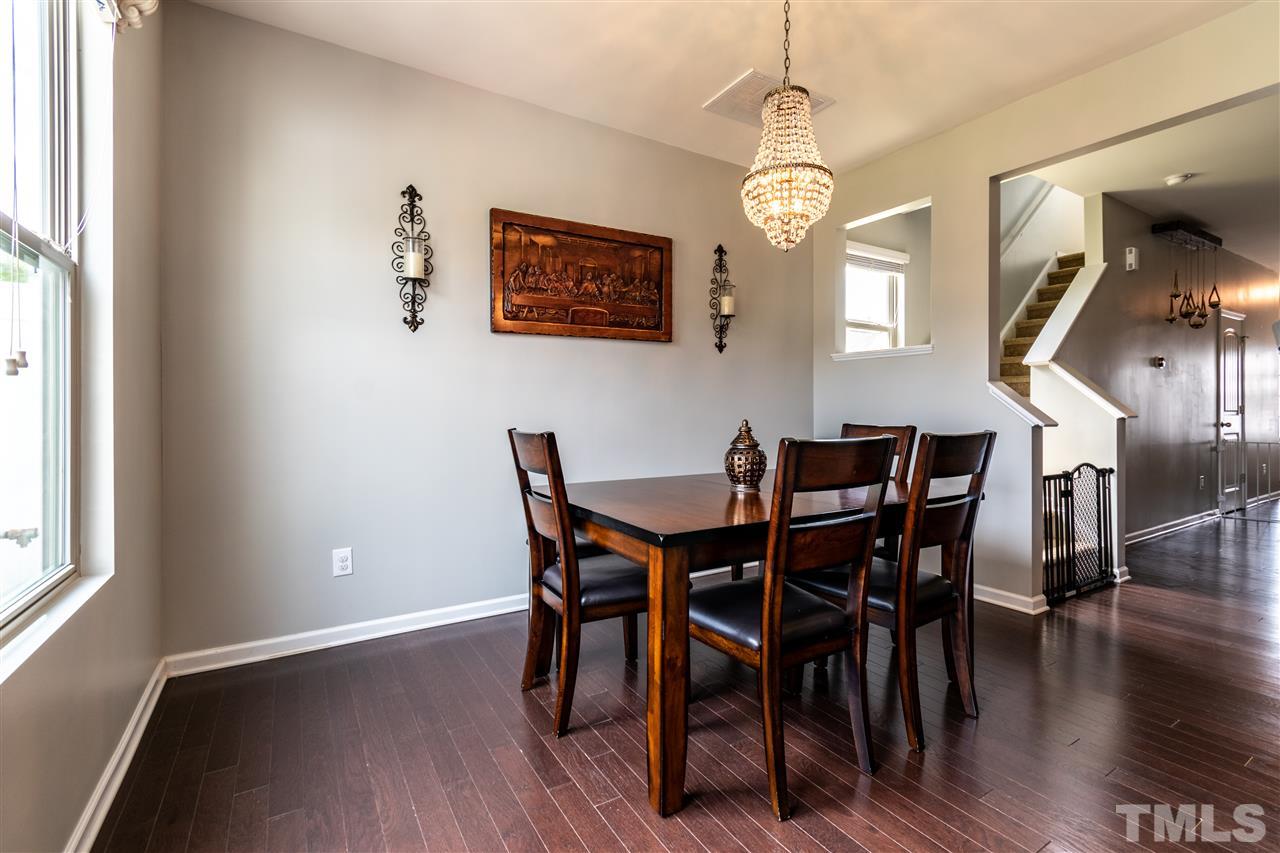302 Leighann Ridge Lane Rolesville, NC 27571 - Photo 10 of 21 a view of a dining room with furniture window and wooden floor