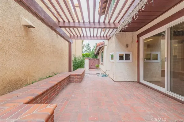 a view of a porch and garden