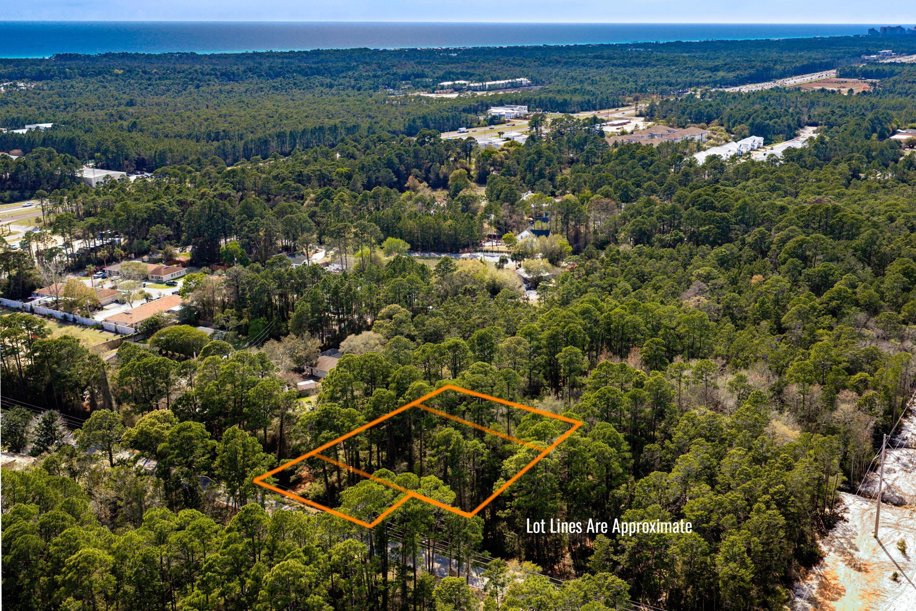 151 Don Bishop Road Santa Rosa Beach, FL 32459 - Photo 1 of 13 an aerial view of a house with a yard