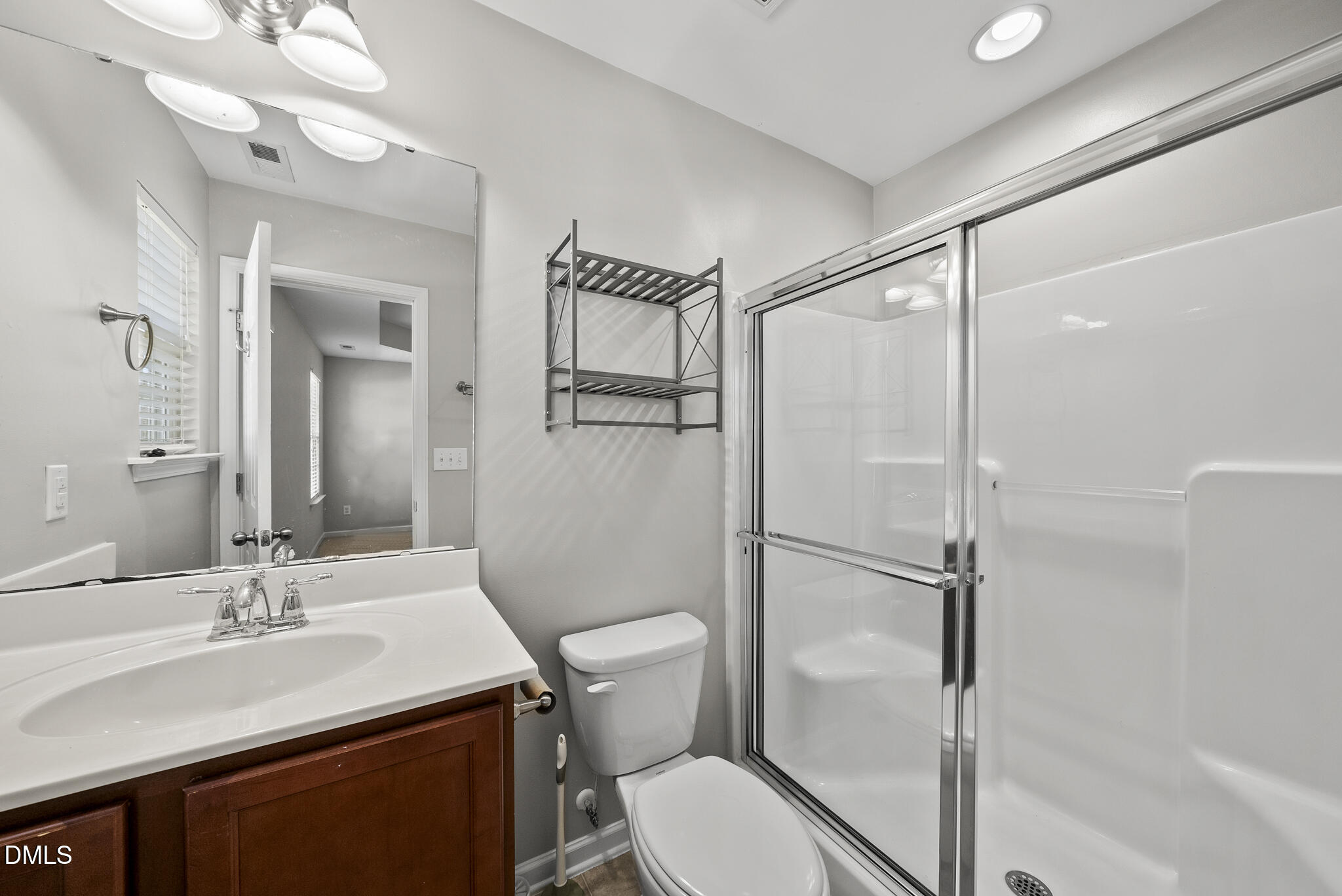 404 Provincial Street Raleigh, NC 27603 - Photo 11 of 24 a bathroom with a sink toilet and shower