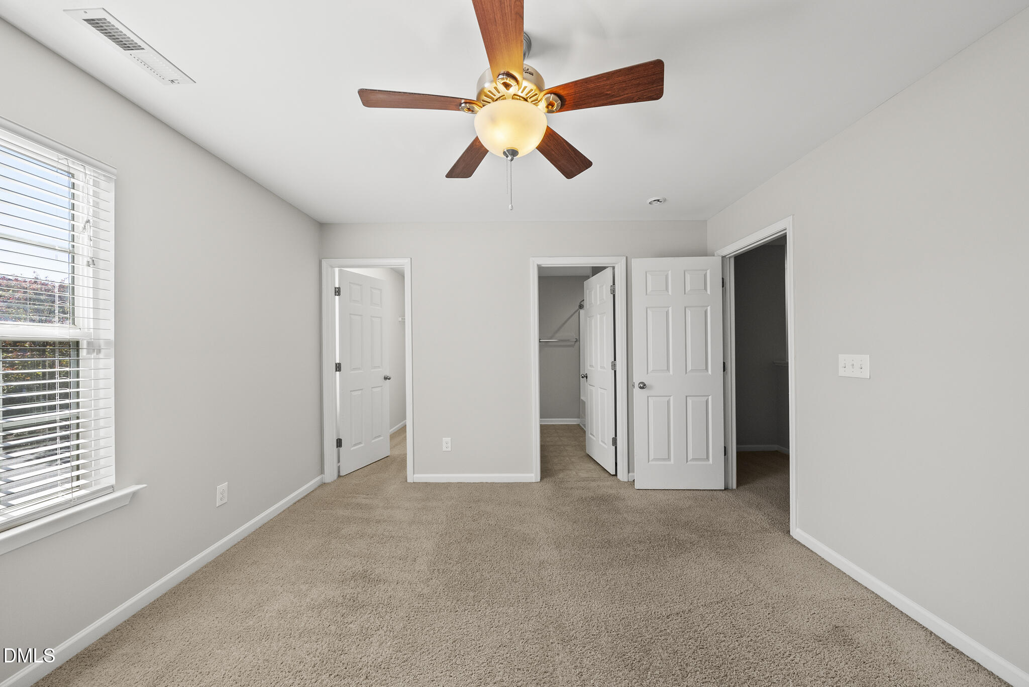 404 Provincial Street Raleigh, NC 27603 - Photo 14 of 24 a view of an empty room with window and a ceiling fan
