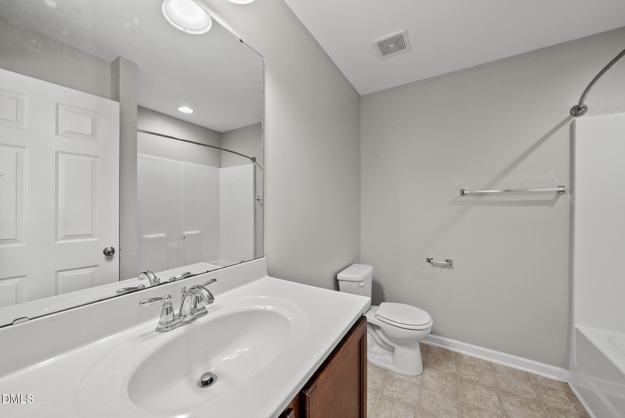 404 Provincial Street Raleigh, NC 27603 - Photo 15 of 24 a bathroom with a sink toilet and shower