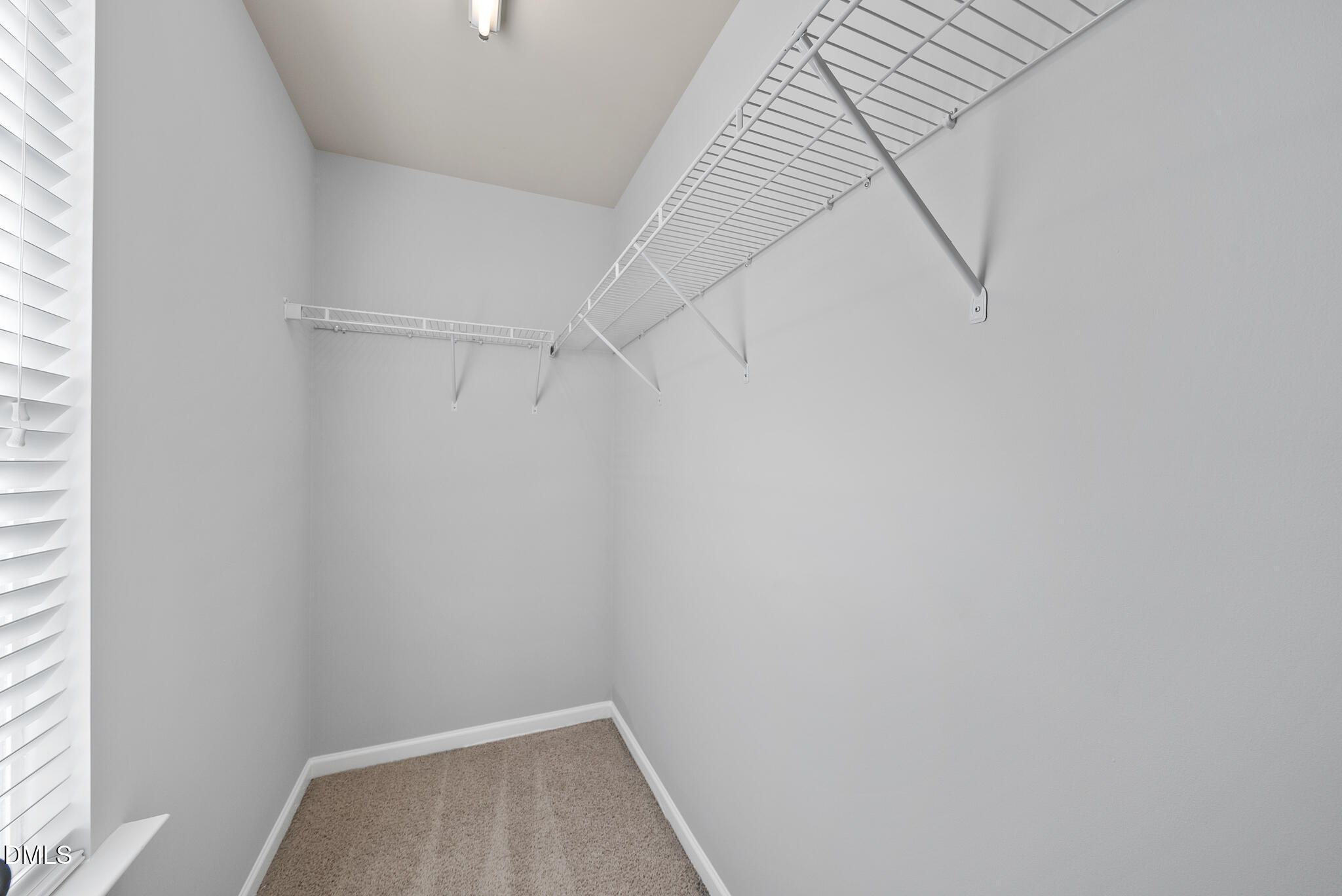 404 Provincial Street Raleigh, NC 27603 - Photo 16 of 24 a view of a room with racks on the wall