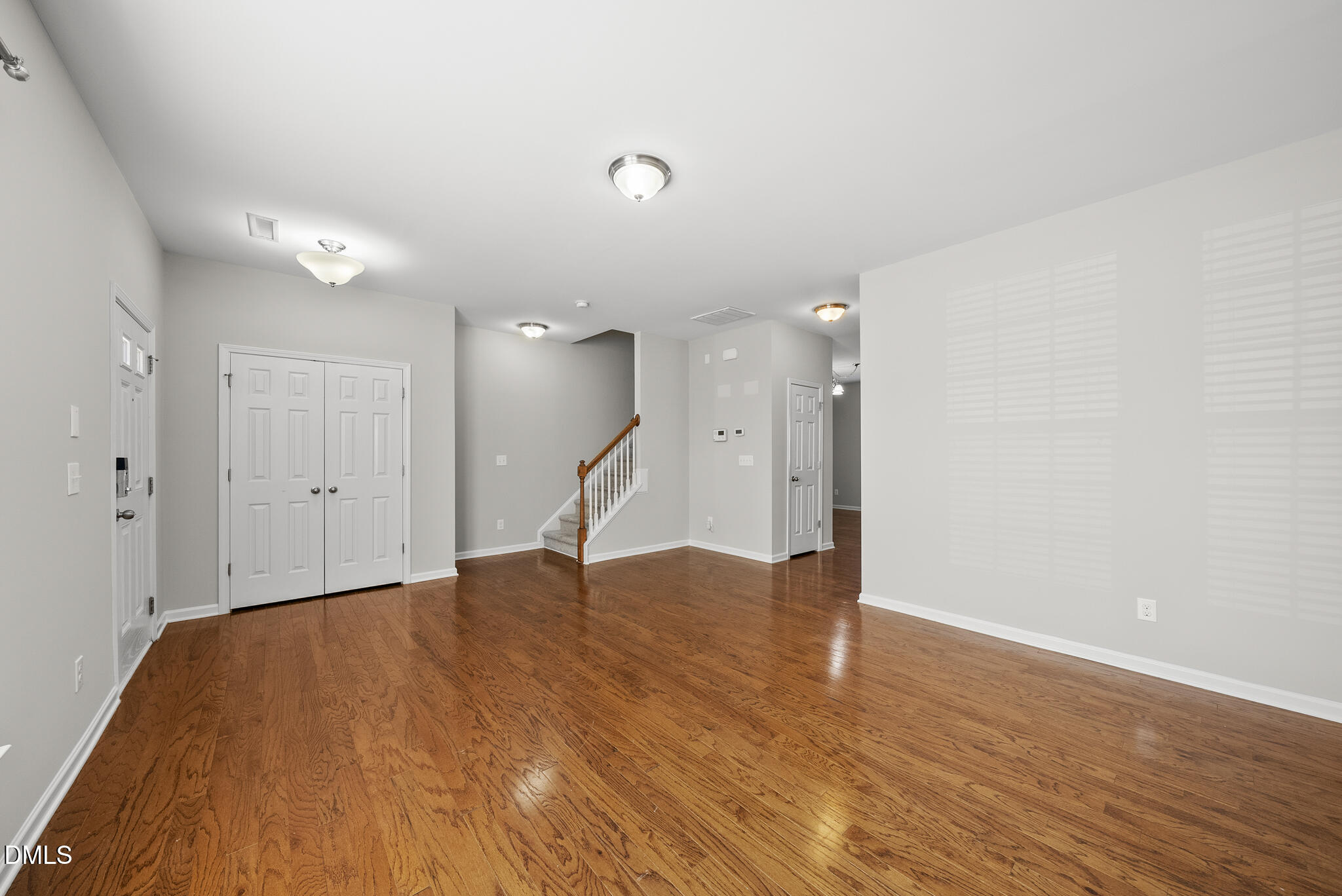 404 Provincial Street Raleigh, NC 27603 - Photo 4 of 24 a view of an empty room with wooden floor