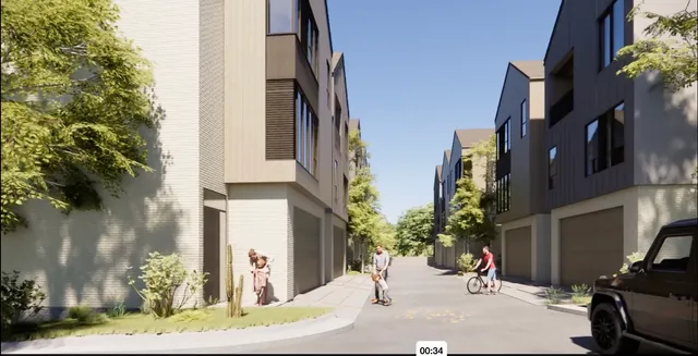 an aerial view of houses with yard