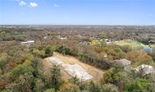 a view of a grassy area with an trees