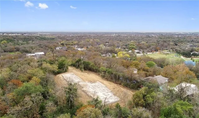 a view of a grassy area with an trees