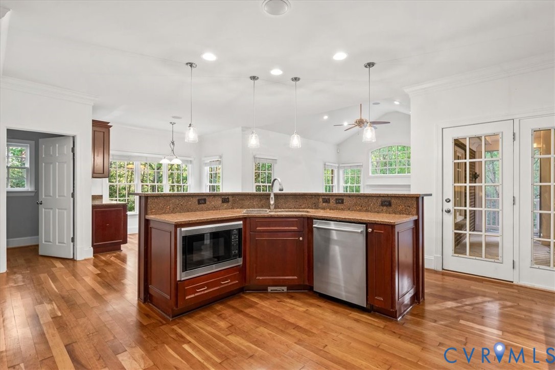 3308 Yarding Way Toano, VA 23168 - Photo 32 of 83 a kitchen with stainless steel appliances granite countertop a stove a sink and a microwave