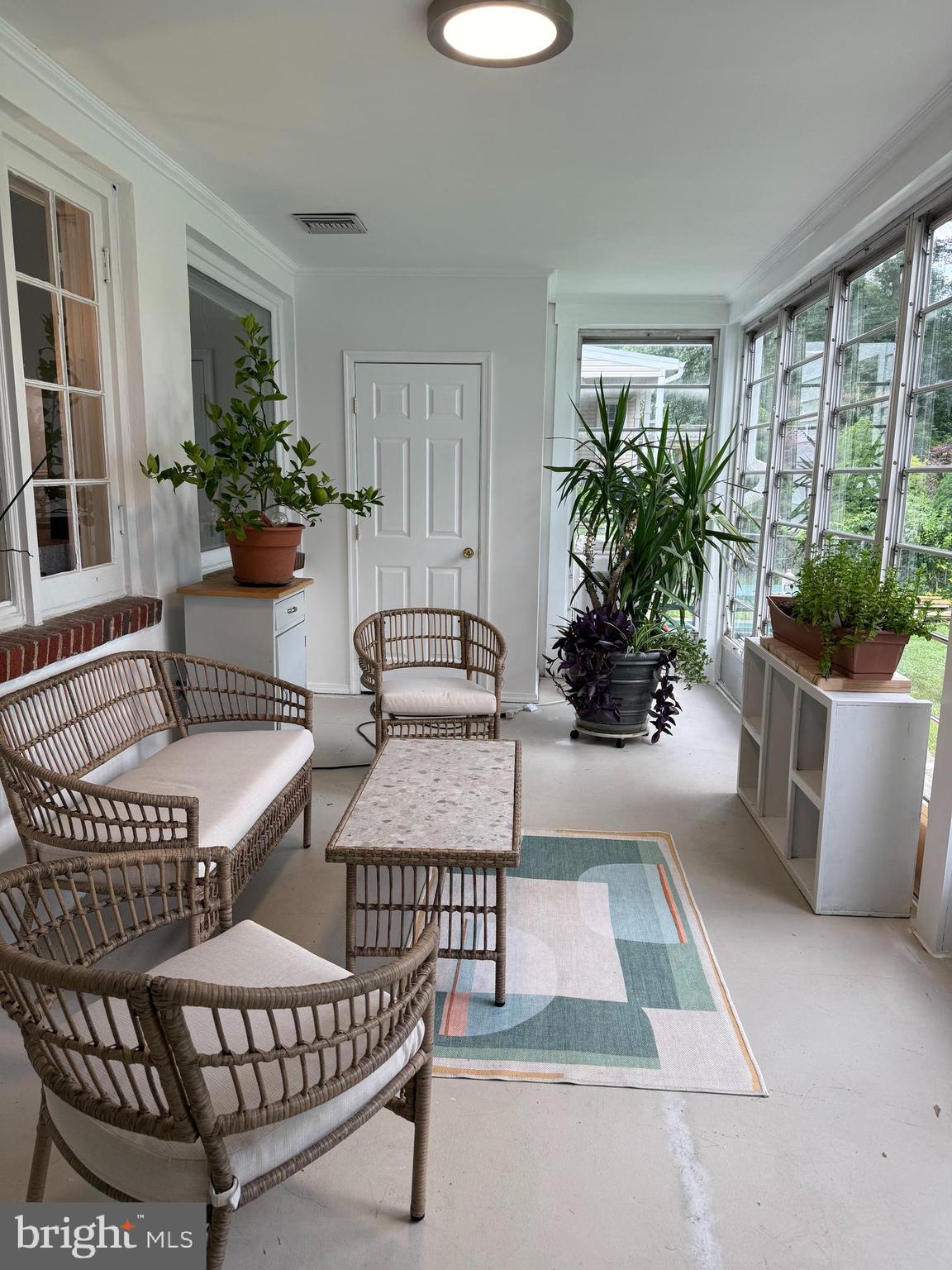 231 Gralan Road Catonsville, MD 21228 - Photo 14 of 37 a living room with furniture and a potted plant