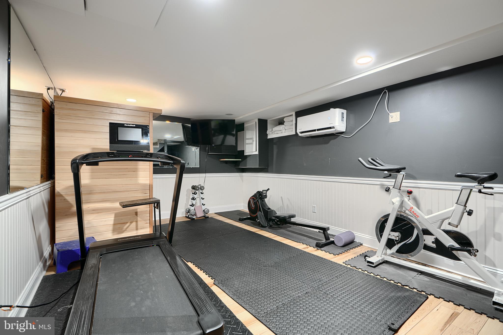 231 Gralan Road Catonsville, MD 21228 - Photo 17 of 37 a room with gym equipment and a large window