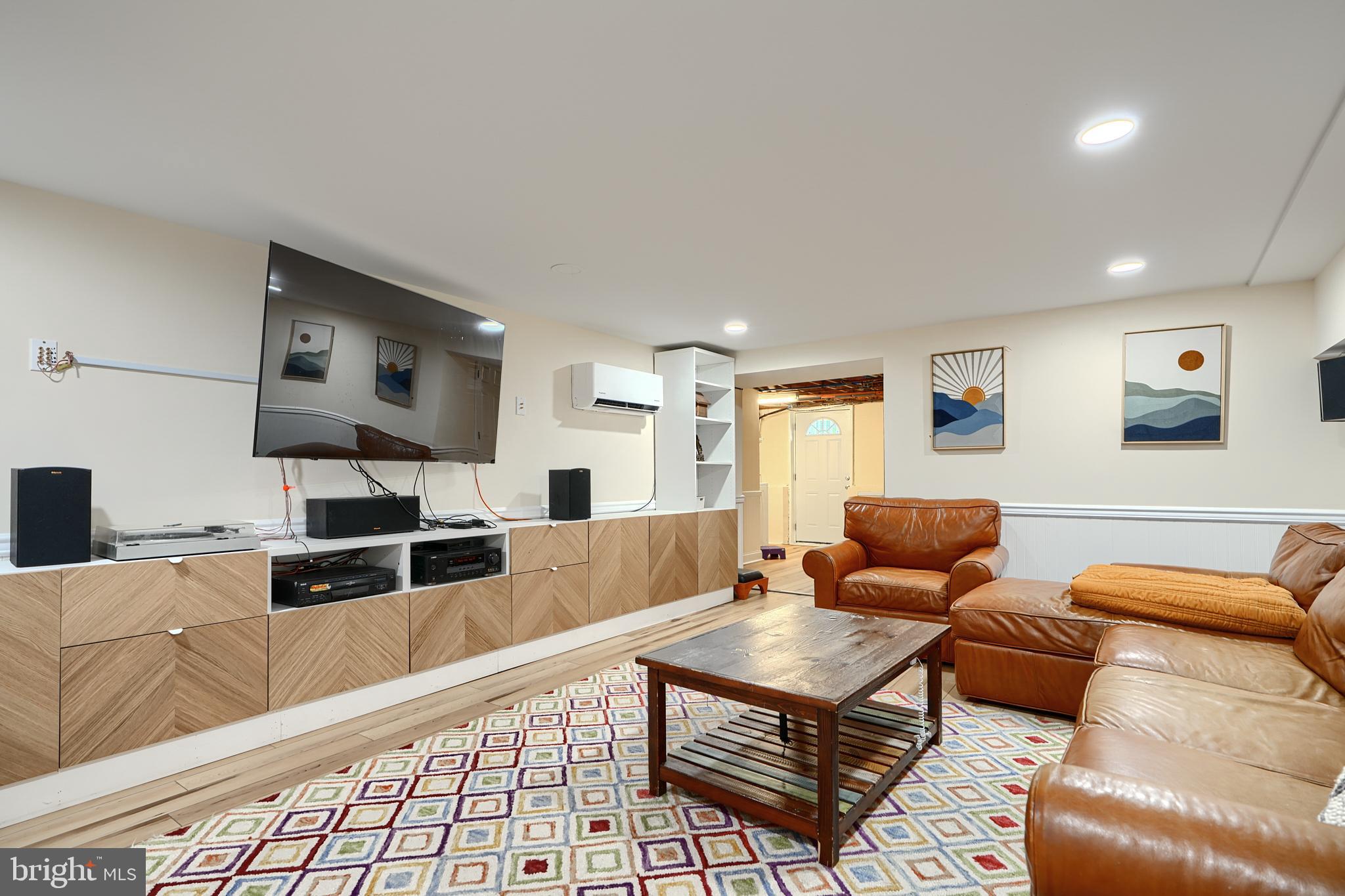 231 Gralan Road Catonsville, MD 21228 - Photo 20 of 37 a living room with furniture fireplace and a flat screen tv