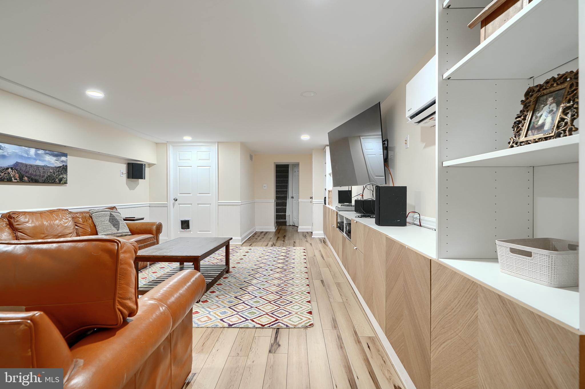231 Gralan Road Catonsville, MD 21228 - Photo 23 of 37 a large living room with stainless steel appliances kitchen island granite countertop a refrigerator and a sink