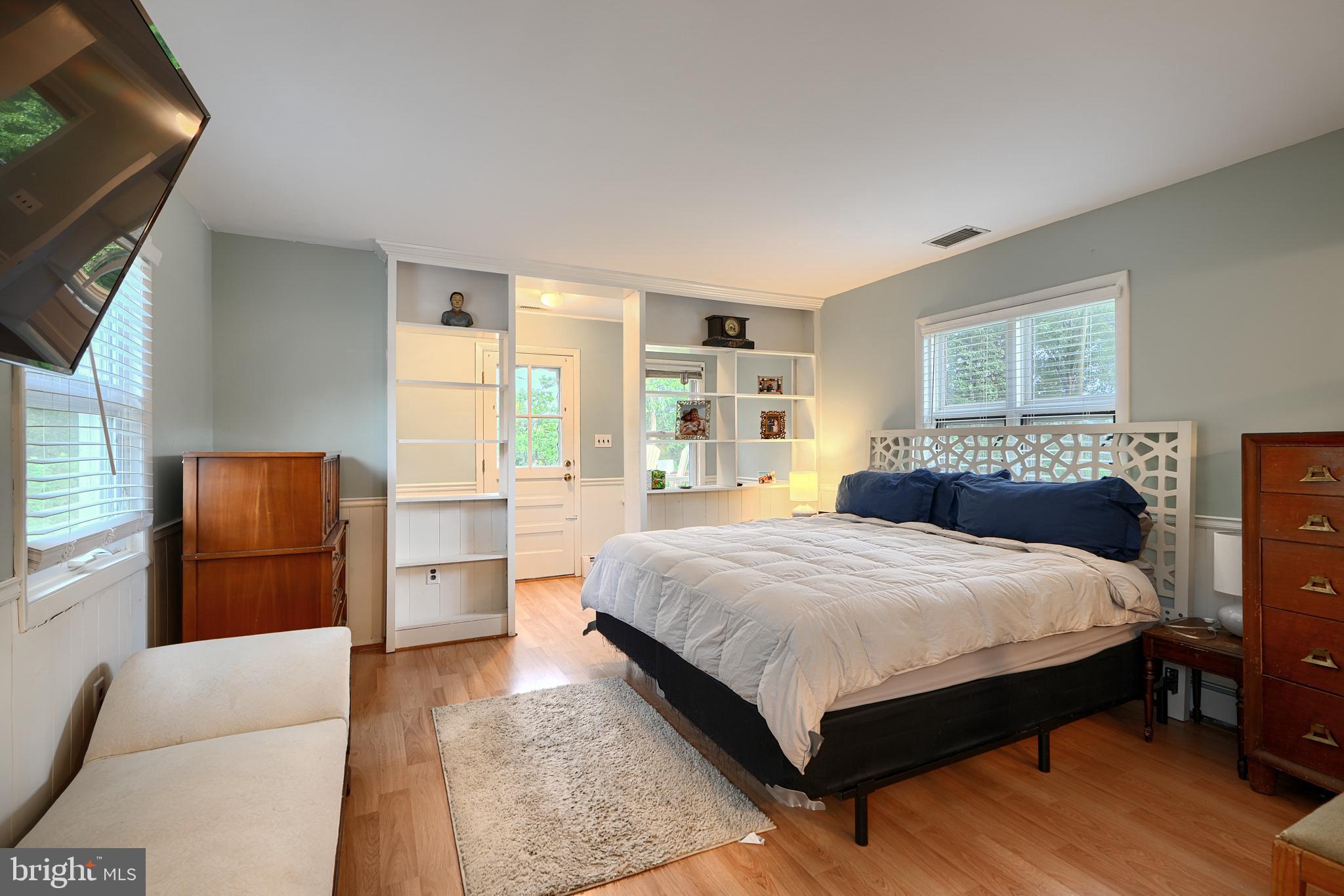 231 Gralan Road Catonsville, MD 21228 - Photo 28 of 37 a bedroom with a large bed and wooden floor