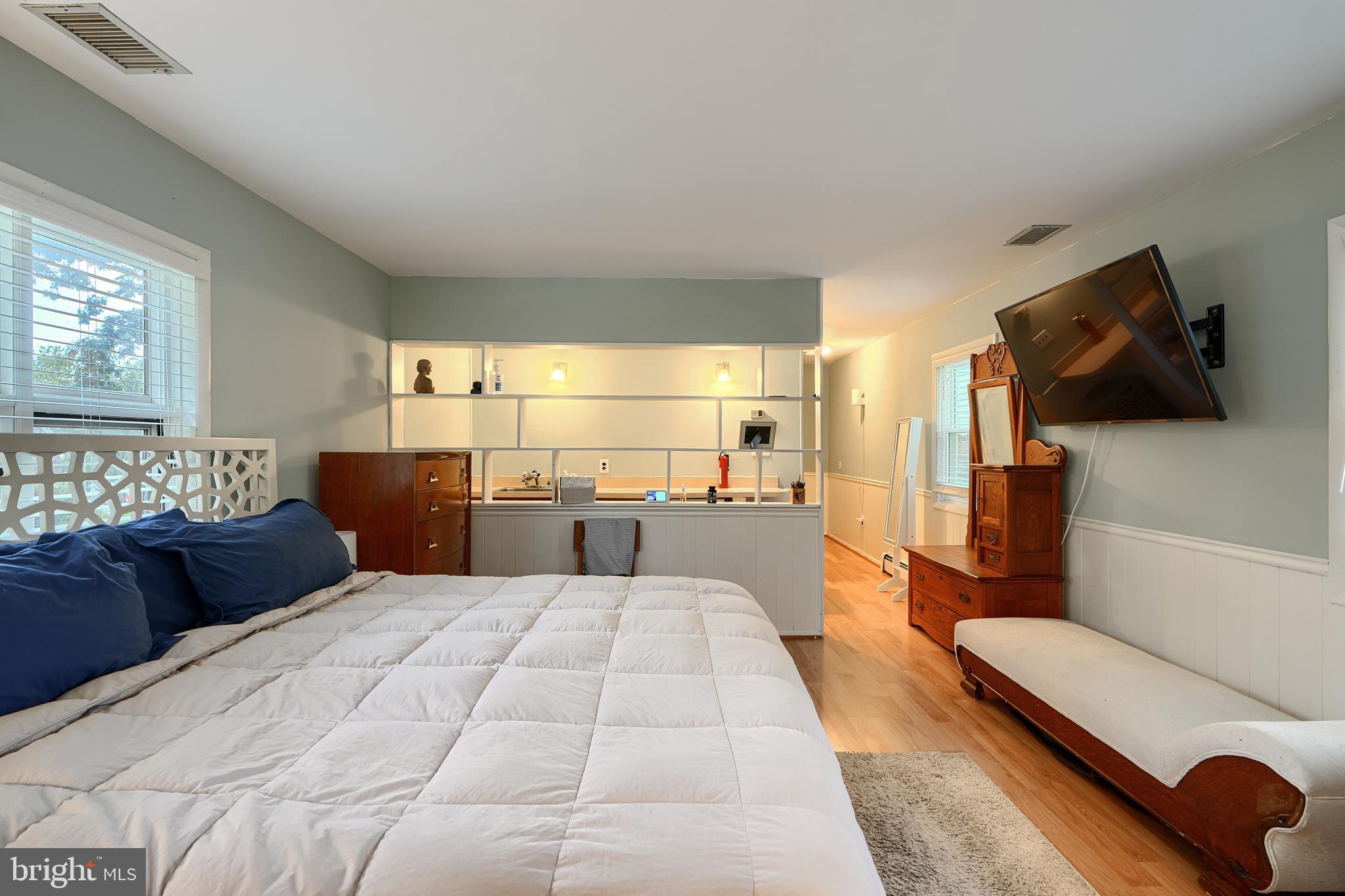 231 Gralan Road Catonsville, MD 21228 - Photo 29 of 37 a living room with a couch and a flat screen tv