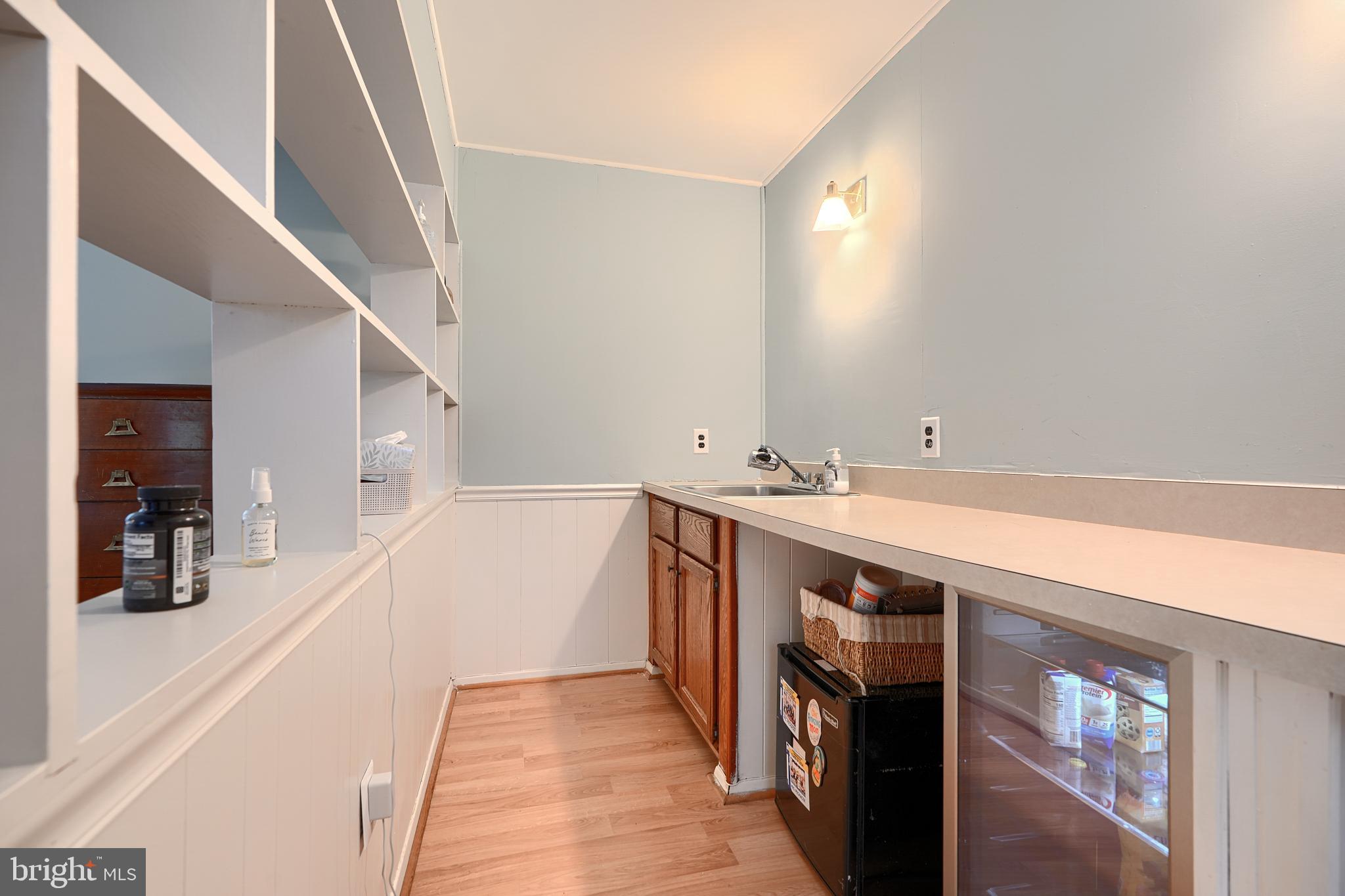 231 Gralan Road Catonsville, MD 21228 - Photo 31 of 37 a spacious bathroom with a double vanity sink and a mirror