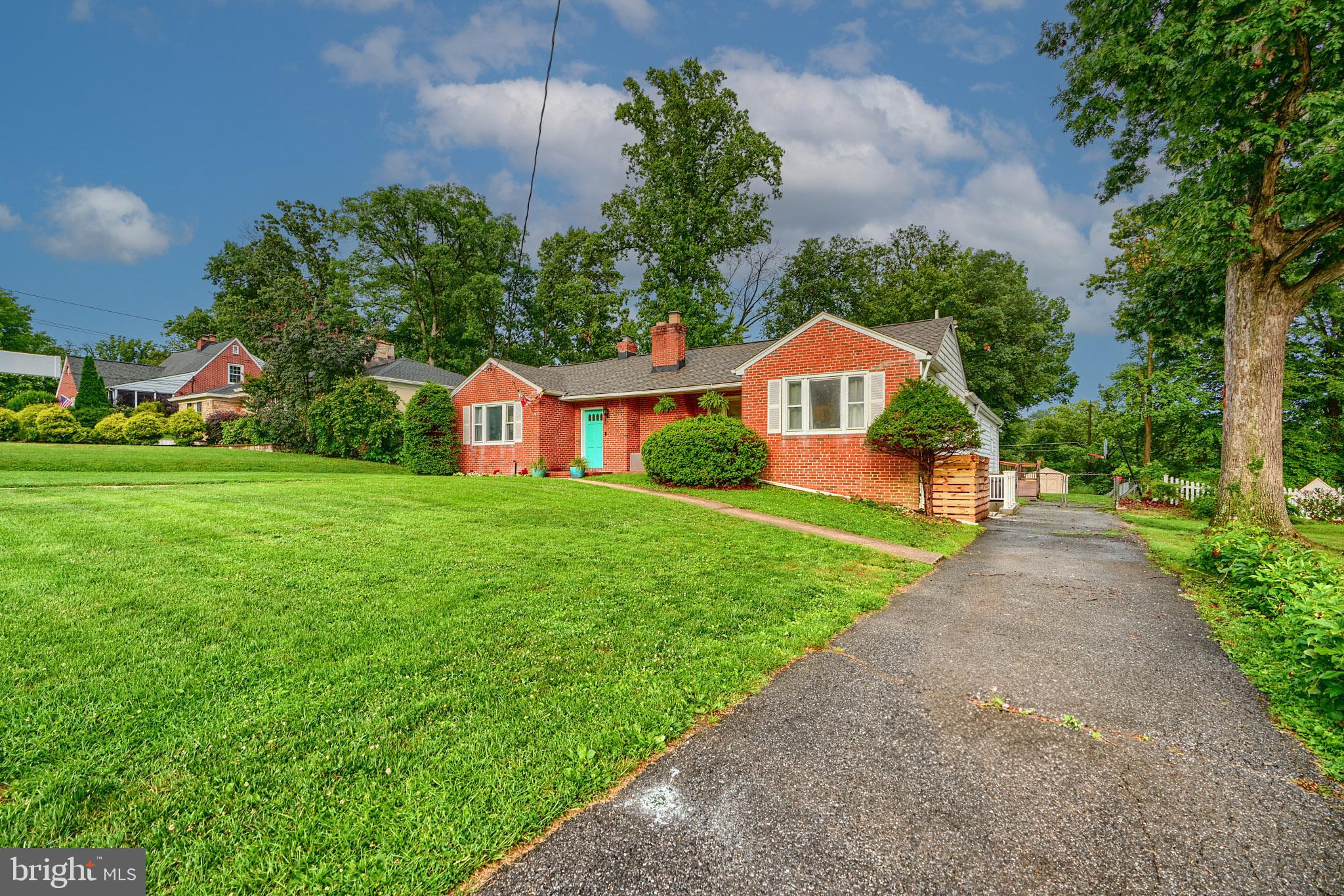 231 Gralan Road Catonsville, MD 21228 - Photo 4 of 37 a front view of a house with garden