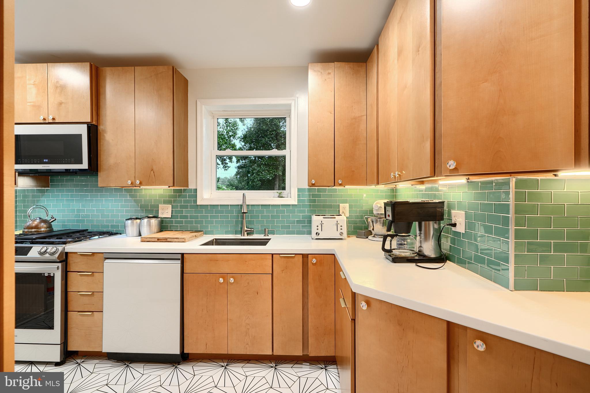 231 Gralan Road Catonsville, MD 21228 - Photo 8 of 37 a kitchen with a sink a stove and cabinets