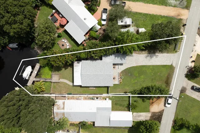 an aerial view of houses with street
