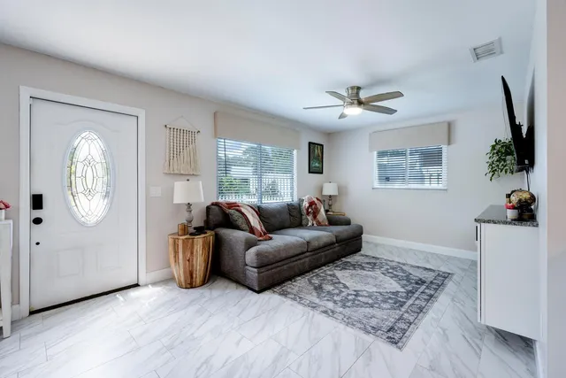 a living room with furniture and a window