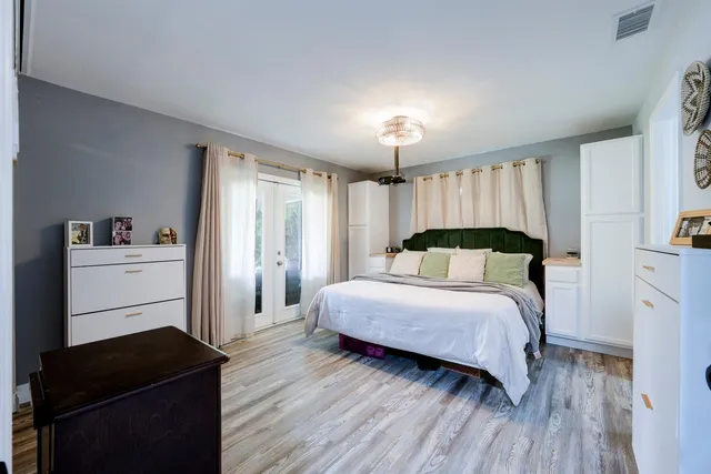 a bedroom with a bed and a closet