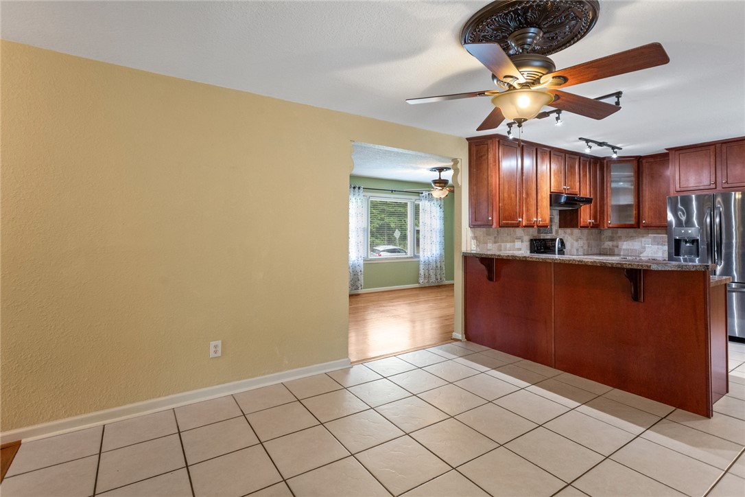 202 Keowee Trail Seneca, SC 29672 - Photo 11 of 35 This spacious kitchen offers ample cabinet storage and a practical breakfast bar for casual dining.