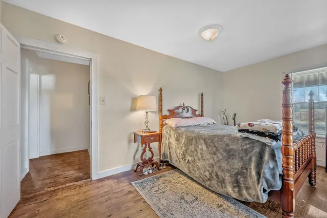 a bedroom with double bed and a window