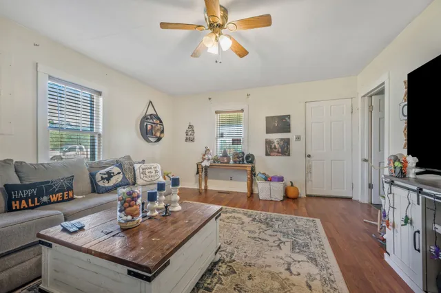 a living room with furniture and a flat screen tv