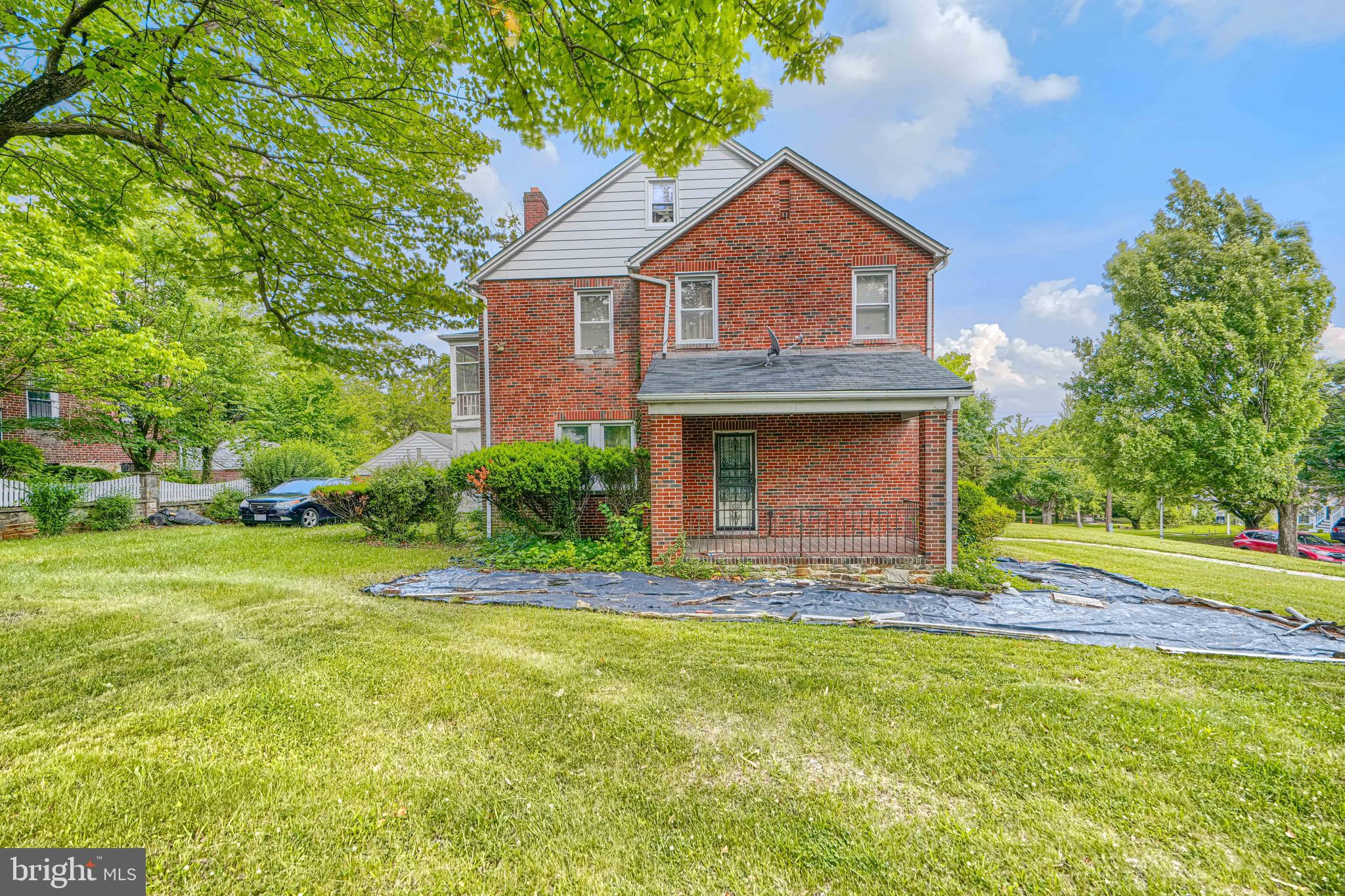 3212 Dorchester Road Baltimore, MD 21215 - Photo 3 of 45 front view of a house with a yard