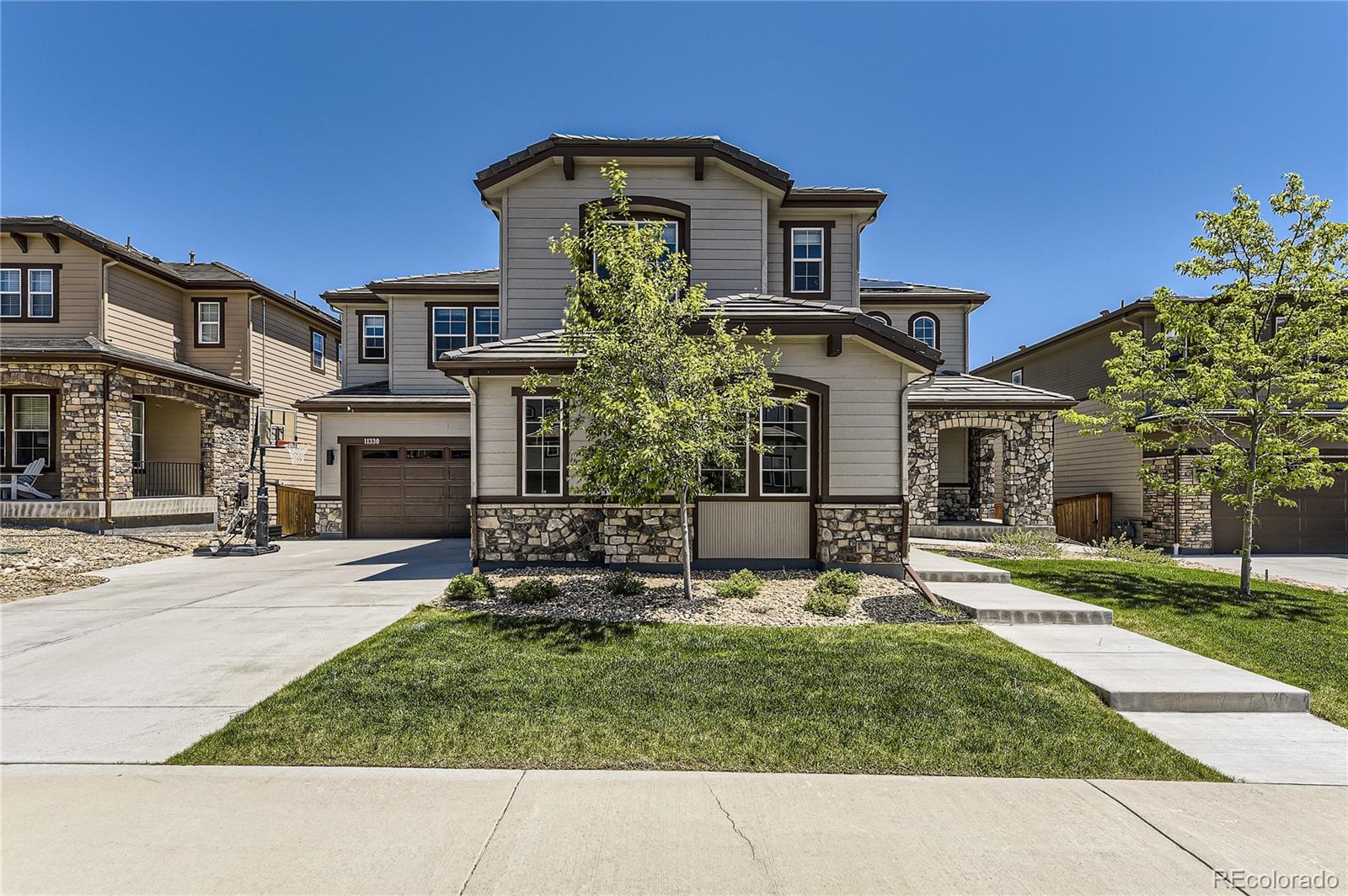 a front view of a house with a yard