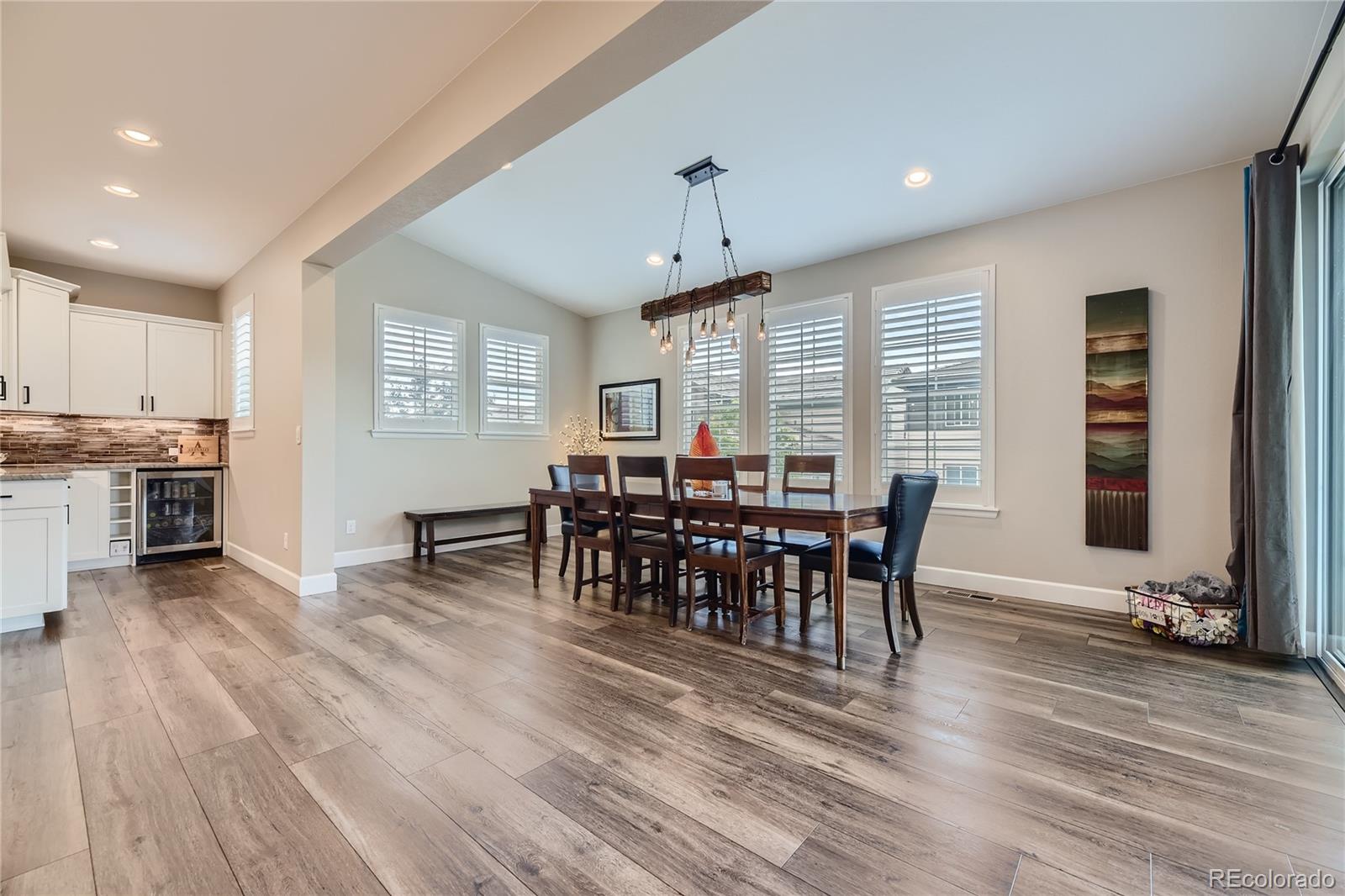11330 Yellow Tip Point Parker, CO 80134 - Photo 13 of 50 a view of a dining room with furniture and wooden floor