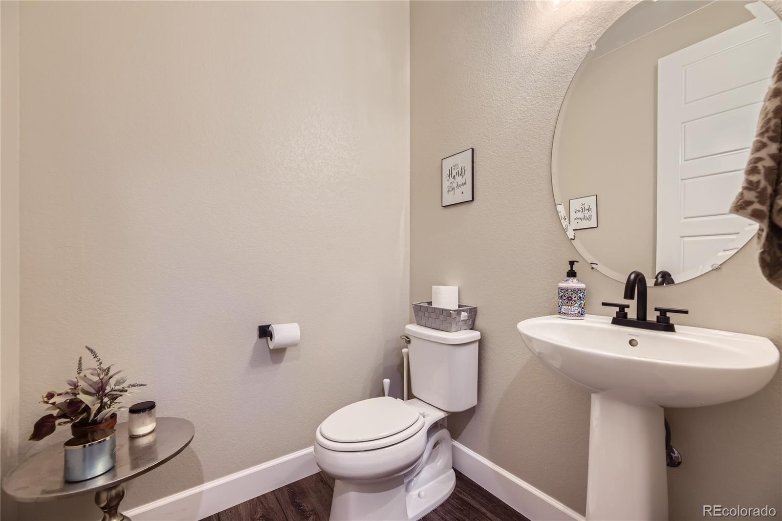 11330 Yellow Tip Point Parker, CO 80134 - Photo 17 of 50 a bathroom with a sink toilet and a mirror
