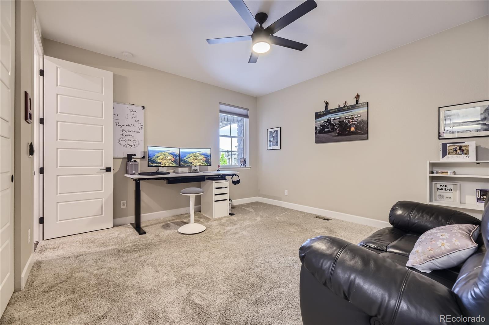 11330 Yellow Tip Point Parker, CO 80134 - Photo 18 of 50 a living room with furniture and a chandelier