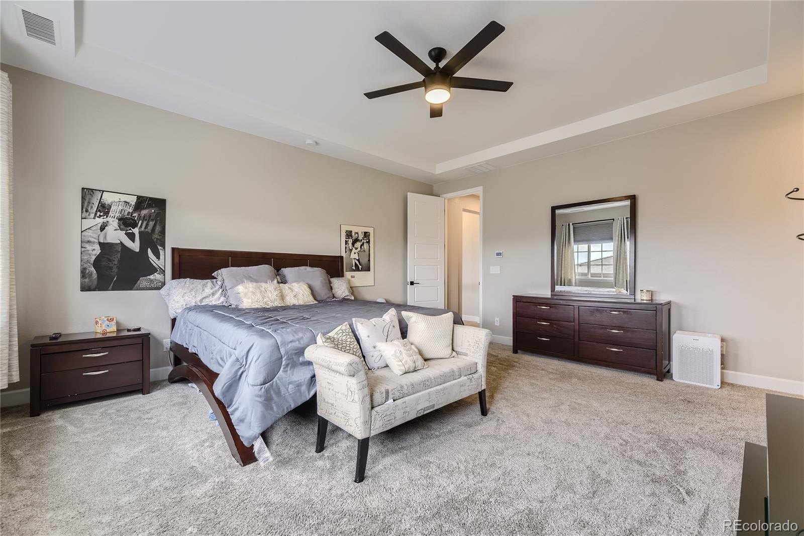 11330 Yellow Tip Point Parker, CO 80134 - Photo 23 of 50 a bedroom with a bed and a painting on the wall