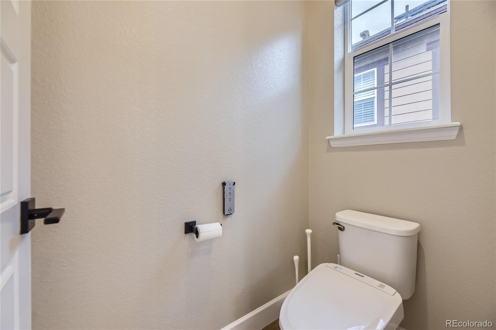 11330 Yellow Tip Point Parker, CO 80134 - Photo 24 of 50 a white toilet sitting next to a window