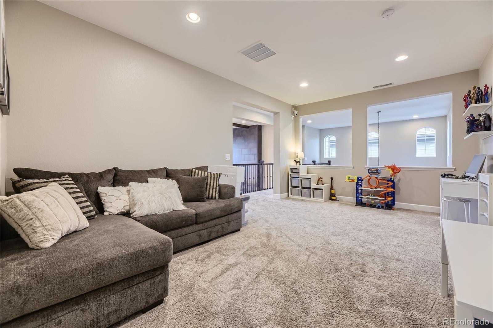 11330 Yellow Tip Point Parker, CO 80134 - Photo 30 of 50 a living room with furniture and a large window
