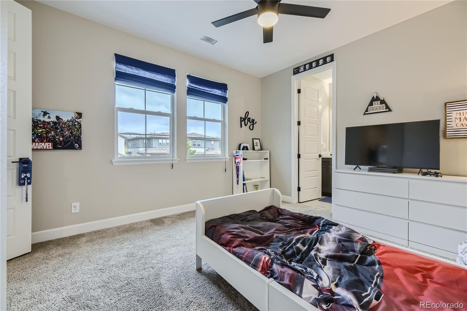 11330 Yellow Tip Point Parker, CO 80134 - Photo 33 of 50 a living room with a flat screen tv and a window