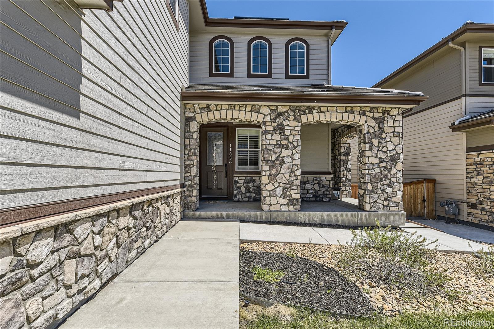 11330 Yellow Tip Point Parker, CO 80134 - Photo 4 of 50 a front view of a house with stairs