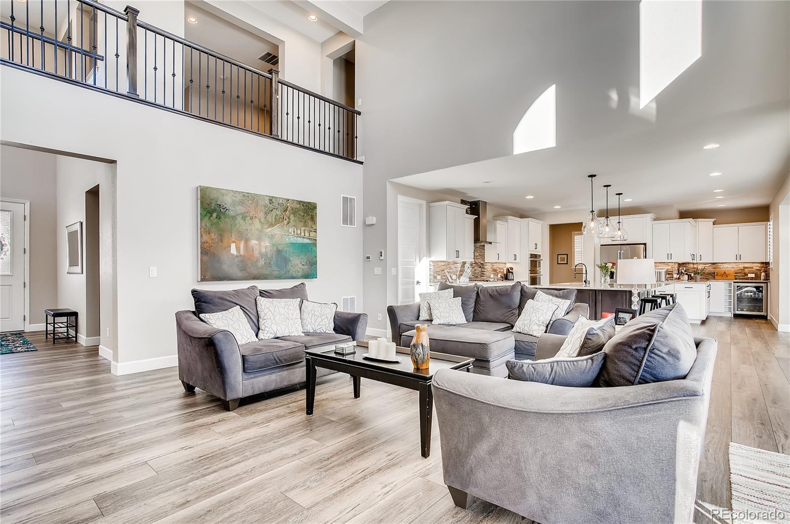 11330 Yellow Tip Point Parker, CO 80134 - Photo 7 of 50 a living room with furniture and a wooden floor