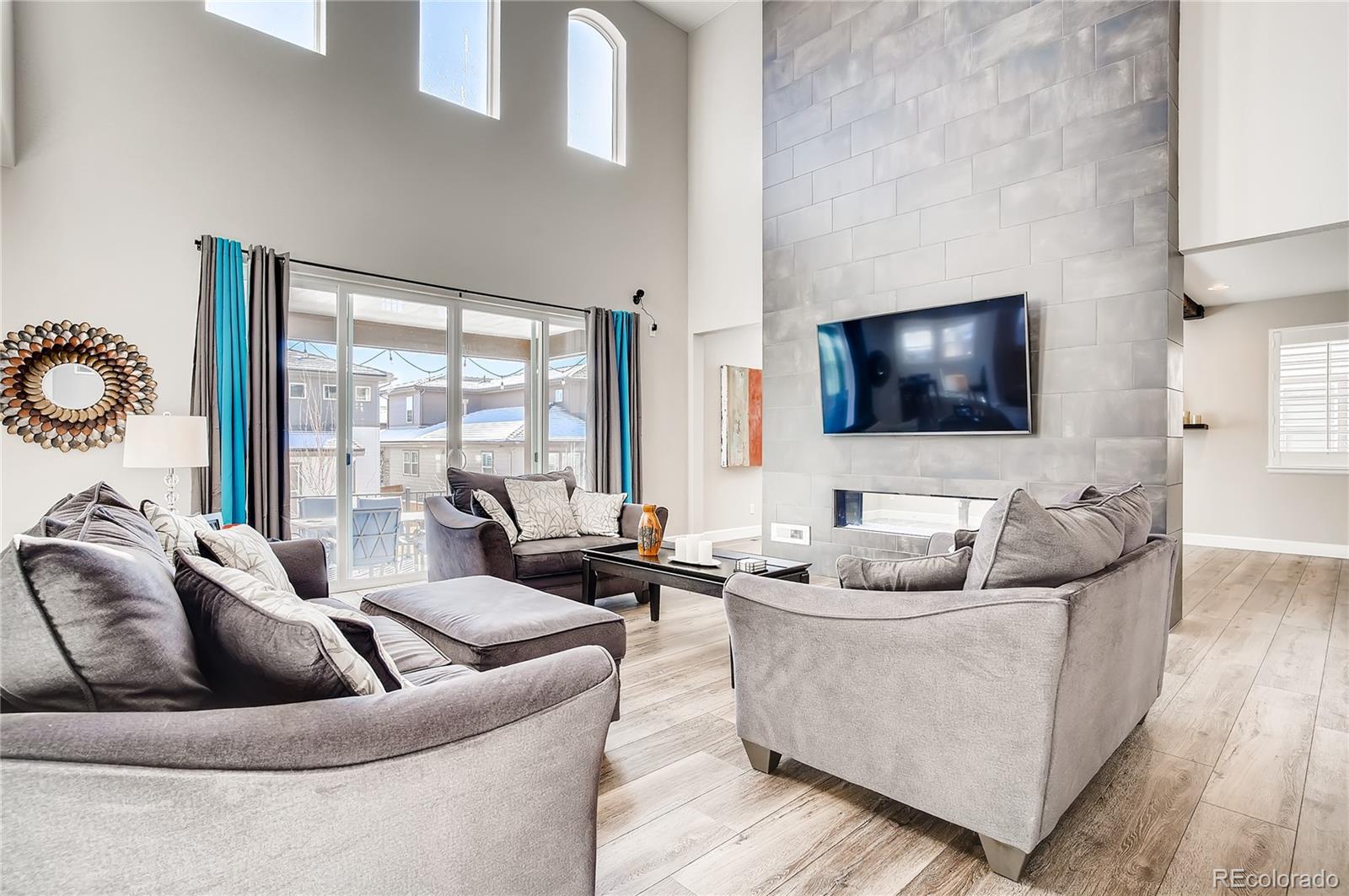 11330 Yellow Tip Point Parker, CO 80134 - Photo 9 of 50 a living room with couches and a flat screen tv