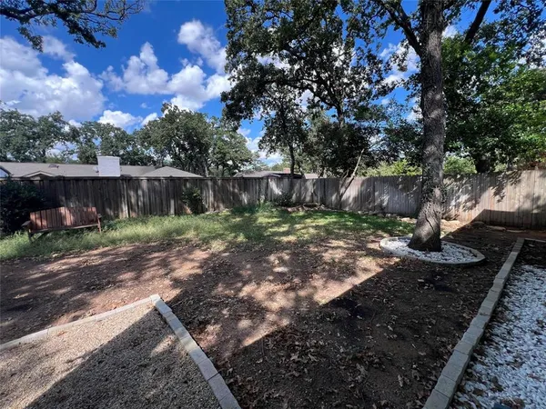 a backyard of a house with lots of green space