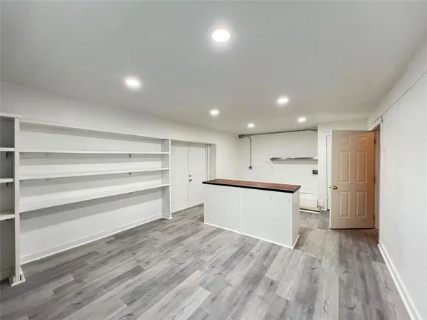 an empty room with wooden floor