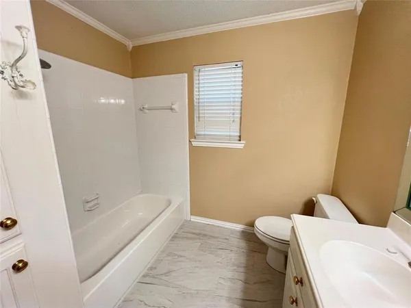 a bathroom with a double vanity sink mirror and toilet